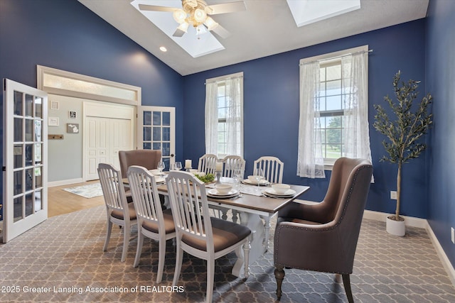 5056 W Bunker Rd, Mason, MI 48854 - dining room featuring a skylight, a ceiling fan, and lofted ceiling