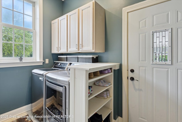 5056 W Bunker Rd, Mason, MI 48854 - washroom featuring separate washer and dryer and cabinet space