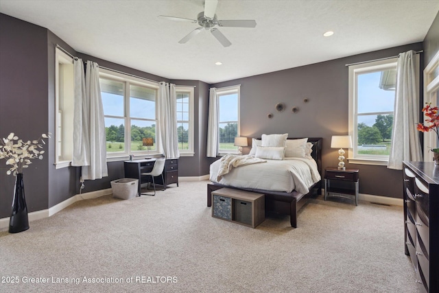 5056 W Bunker Rd, Mason, MI 48854 - bedroom with carpet flooring, built in desk, ceiling fan, and recessed lighting
