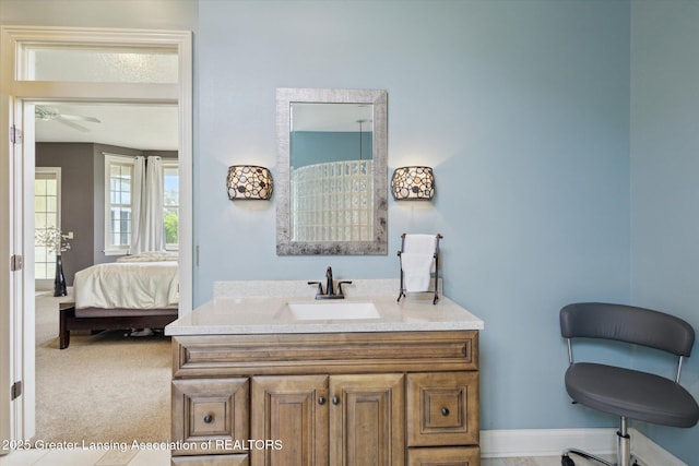 5056 W Bunker Rd, Mason, MI 48854 - ensuite bathroom featuring vanity and ceiling fan