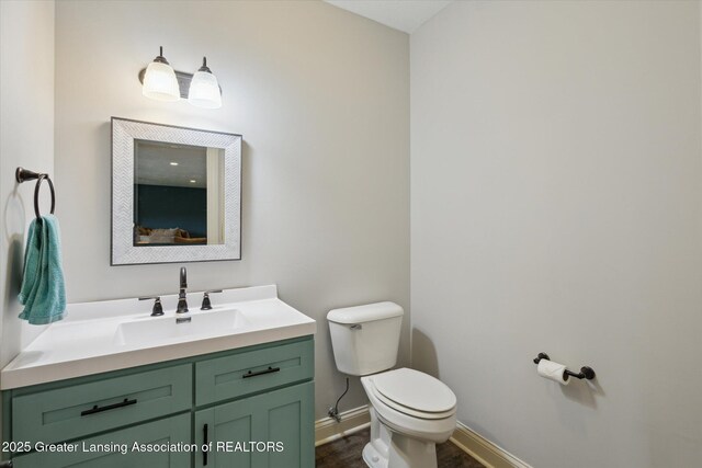 5056 W Bunker Rd, Mason, MI 48854 - bathroom featuring vanity and wood finished floors