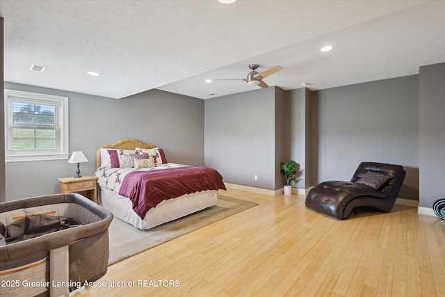 5056 W Bunker Rd, Mason, MI 48854 - bedroom with wood finished floors, recessed lighting, and ceiling fan