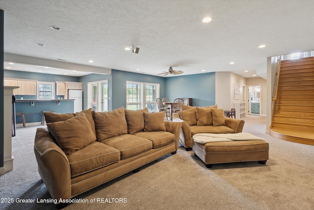 5056 W Bunker Rd, Mason, MI 48854 - living area with light carpet, recessed lighting, stairway, a ceiling fan, and a textured ceiling