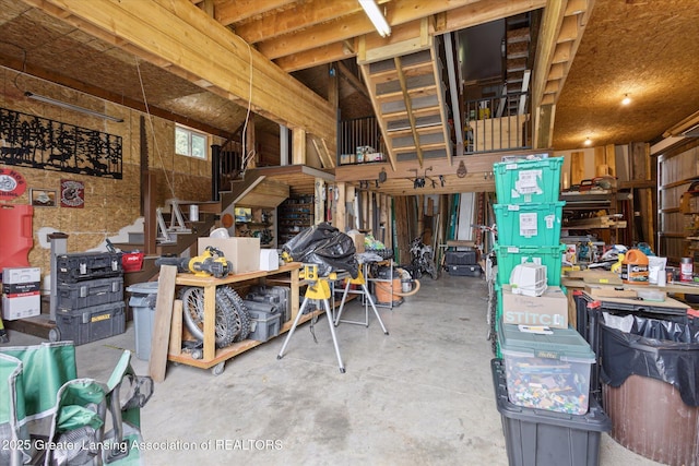 5056 W Bunker Rd, Mason, MI 48854 - miscellaneous room featuring concrete flooring and stairs