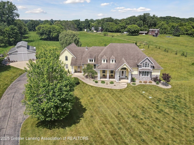5056 W Bunker Rd, Mason, MI 48854 - view of front of property with a porch and a front yard