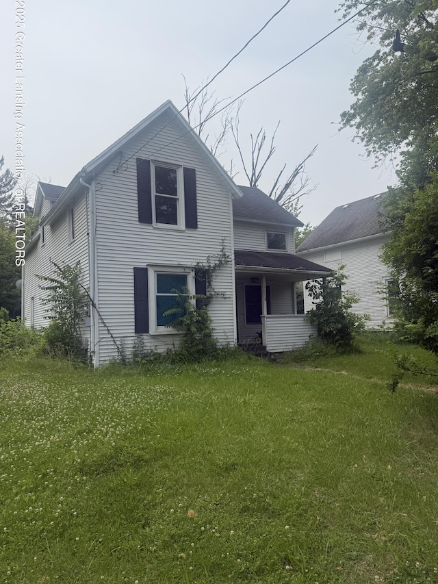 1018 E Kalamazoo St, Lansing, MI 48912 - view of front of house featuring a front lawn