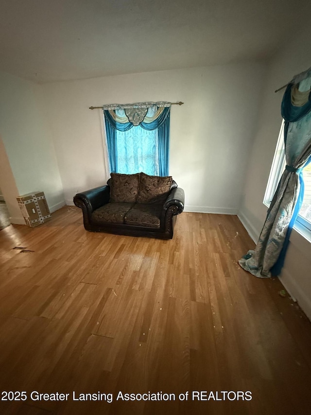 1018 E Kalamazoo St, Lansing, MI 48912 - sitting room with wood finished floors and baseboards