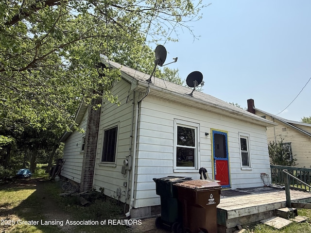 4317 S Cedar St, Lansing, MI 48910 - rear view of house featuring a wooden deck