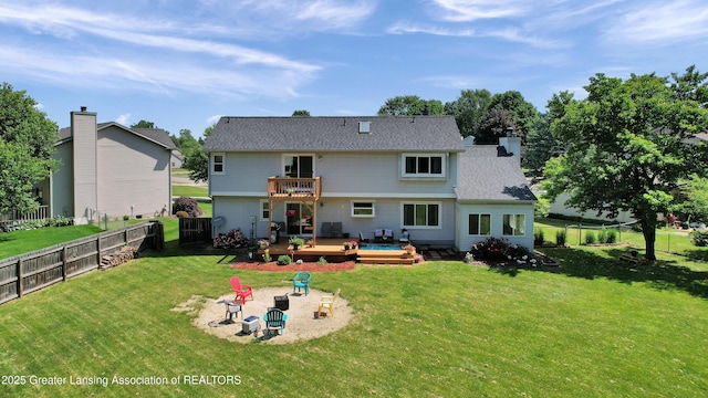 5925 Cabrena Dr, Lansing, MI 48917 - back of property with a deck, a fenced backyard, a balcony, a patio area, and a chimney