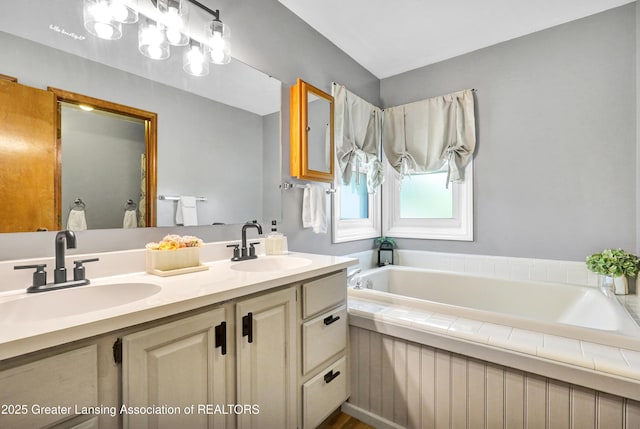 5925 Cabrena Dr, Lansing, MI 48917 - full bath with double vanity and a bath