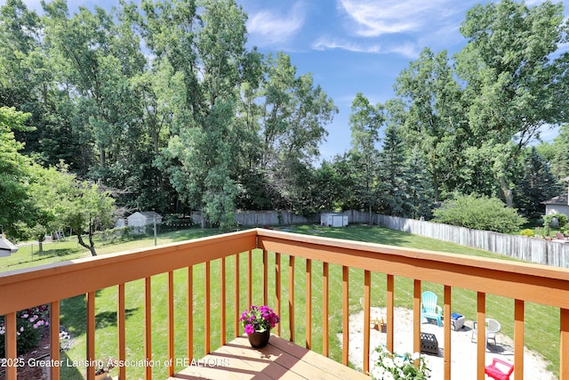 5925 Cabrena Dr, Lansing, MI 48917 - wooden deck with a fenced backyard