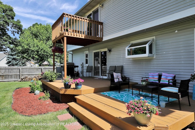 5925 Cabrena Dr, Lansing, MI 48917 - wooden deck with an outdoor living space and area for grilling