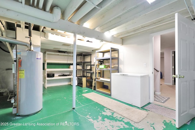 5925 Cabrena Dr, Lansing, MI 48917 - unfinished below grade area with water heater and refrigerator