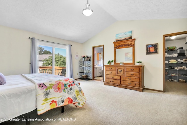 5925 Cabrena Dr, Lansing, MI 48917 - carpeted bedroom featuring vaulted ceiling, access to exterior, a textured ceiling, and connected bathroom