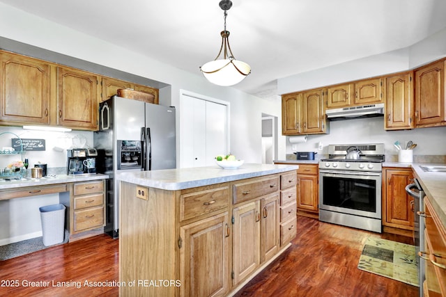 5925 Cabrena Dr, Lansing, MI 48917 - kitchen with stainless steel stove, refrigerator with ice dispenser, under cabinet range hood, dark wood-style floors, and light countertops