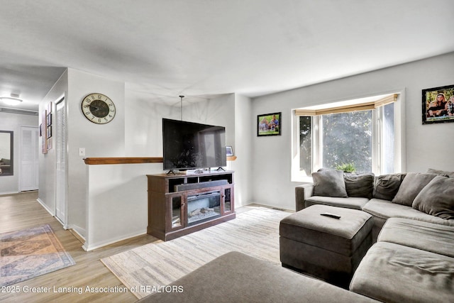 314 Scarlet Oak Ln, Perry, MI 48872 - living room with wood finished floors and baseboards