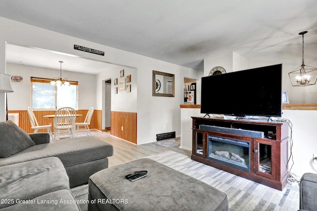 314 Scarlet Oak Ln, Perry, MI 48872 - living room with a chandelier and wood finished floors