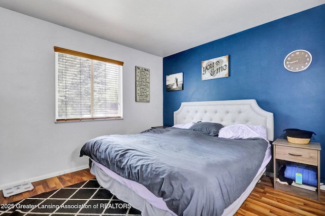 314 Scarlet Oak Ln, Perry, MI 48872 - bedroom featuring wood finished floors and baseboards