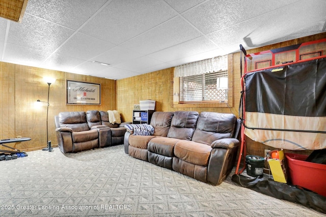 314 Scarlet Oak Ln, Perry, MI 48872 - carpeted living area with wooden walls and a paneled ceiling
