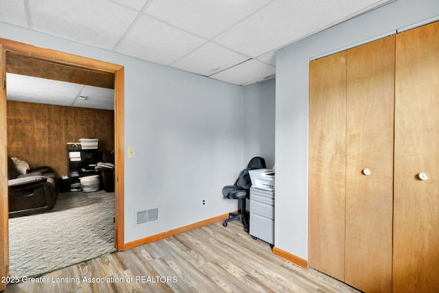 314 Scarlet Oak Ln, Perry, MI 48872 - unfurnished office with a paneled ceiling and light wood-style flooring