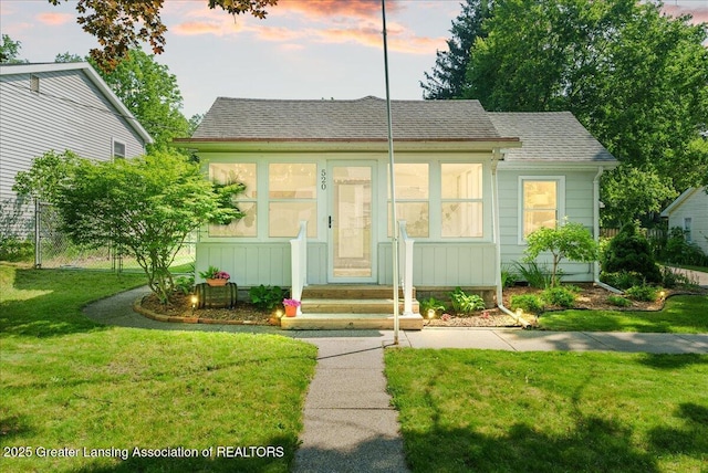 520 Wood St, Eaton Rapids, MI 48827 - bungalow-style house featuring a shingled roof