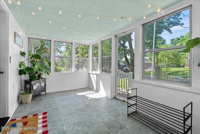 520 Wood St, Eaton Rapids, MI 48827 - unfurnished sunroom with rail lighting