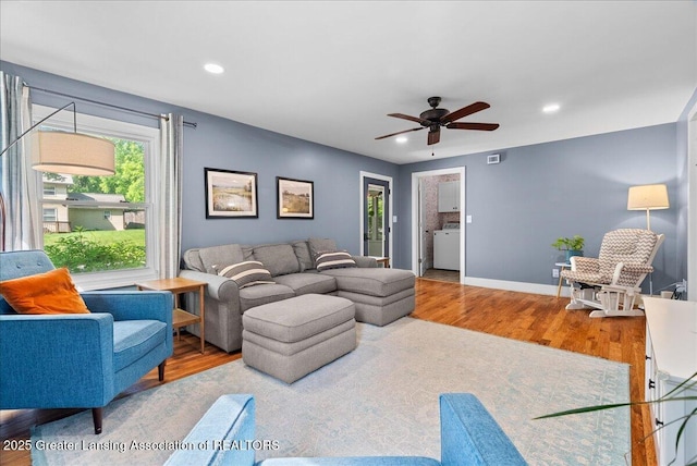 520 Wood St, Eaton Rapids, MI 48827 - living area with wood finished floors, a ceiling fan, recessed lighting, and washer / dryer