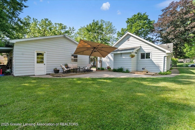 520 Wood St, Eaton Rapids, MI 48827 - back of house featuring a patio and a lawn