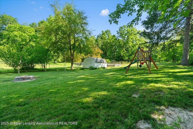 520 Wood St, Eaton Rapids, MI 48827 - view of yard with a playground and a storage unit