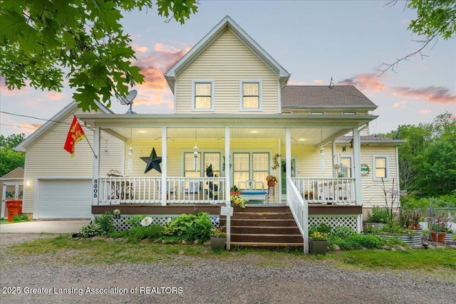 8805 E Cole Rd, Durand, MI 48429 - view of front facade with covered porch, driveway, and a garage