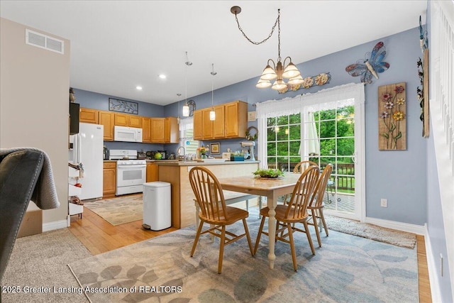 8805 E Cole Rd, Durand, MI 48429 - dining room featuring a chandelier, light wood-style floors, and recessed lighting
