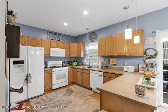 8805 E Cole Rd, Durand, MI 48429 - kitchen featuring white appliances, pendant lighting, light wood-style floors, recessed lighting, and a peninsula