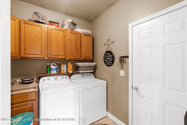 8805 E Cole Rd, Durand, MI 48429 - washroom with cabinet space, washing machine and dryer, and light tile patterned floors