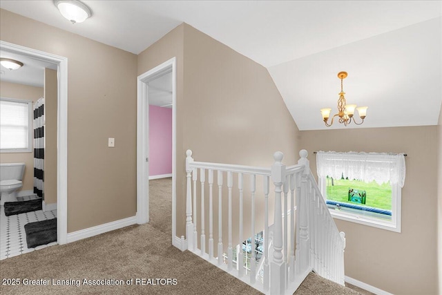 8805 E Cole Rd, Durand, MI 48429 - hall featuring an upstairs landing, a chandelier, carpet flooring, and vaulted ceiling