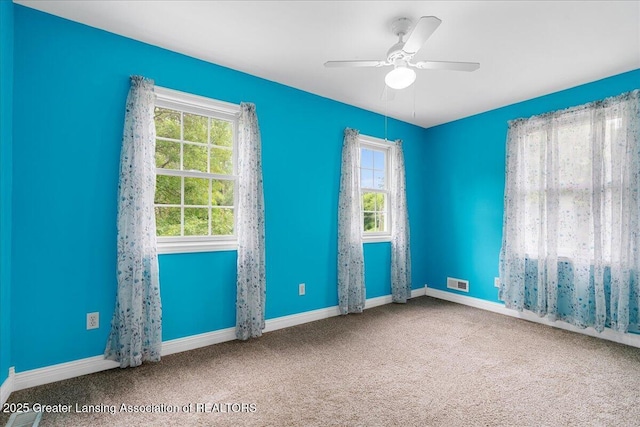 8805 E Cole Rd, Durand, MI 48429 - spare room featuring carpet flooring and a ceiling fan