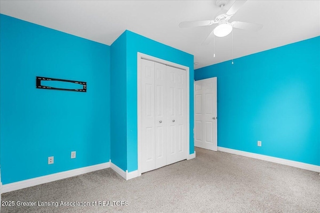 8805 E Cole Rd, Durand, MI 48429 - unfurnished bedroom with carpet, a closet, and a ceiling fan