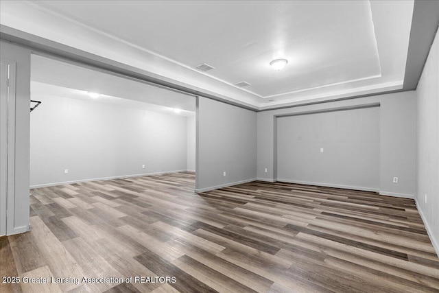 8805 E Cole Rd, Durand, MI 48429 - unfurnished room with wood finished floors and a tray ceiling