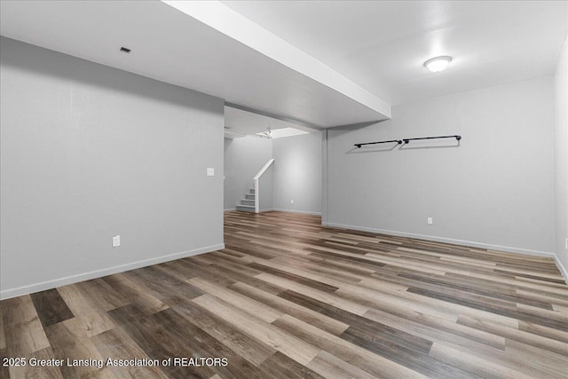 8805 E Cole Rd, Durand, MI 48429 - finished below grade area featuring wood finished floors and stairway