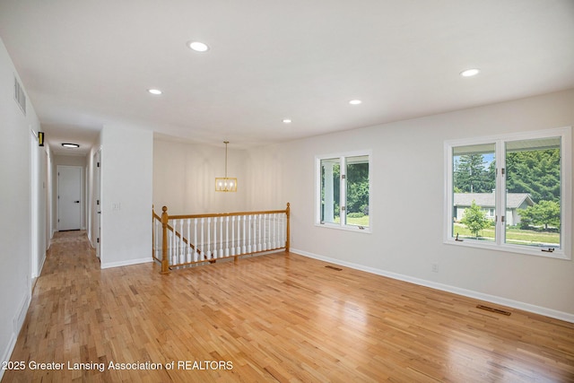 3861 New Salem Ave, Okemos, MI 48864 - spare room with light wood-style floors, recessed lighting, and a chandelier