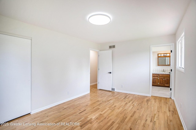 3861 New Salem Ave, Okemos, MI 48864 - unfurnished bedroom with light wood-style flooring and ensuite bath