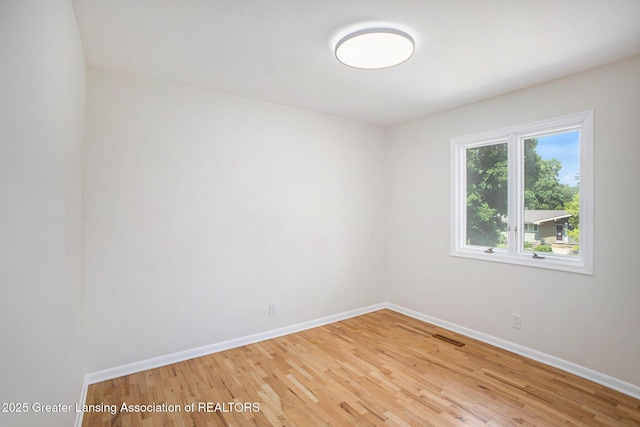 3861 New Salem Ave, Okemos, MI 48864 - spare room with baseboards and light wood-type flooring