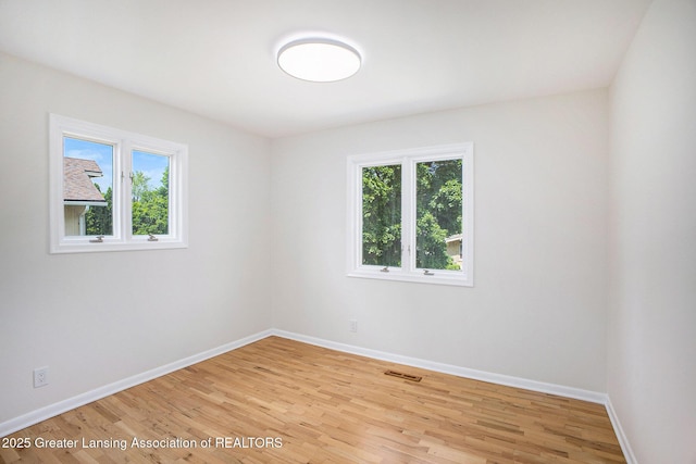 3861 New Salem Ave, Okemos, MI 48864 - unfurnished room featuring light wood-style floors and baseboards