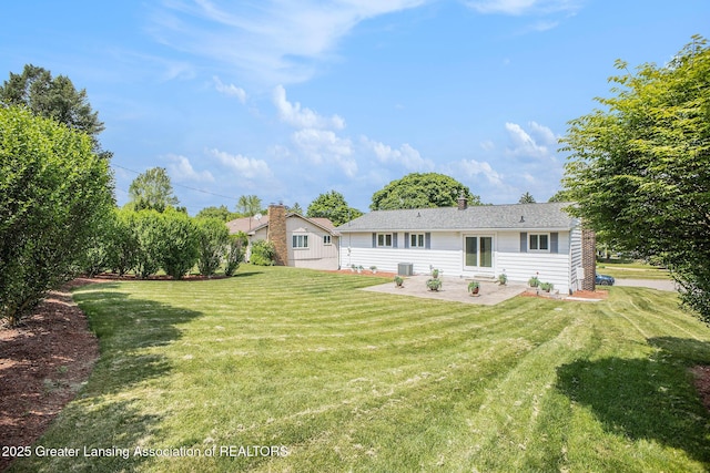 3861 New Salem Ave, Okemos, MI 48864 - rear view of house with a patio area and a yard