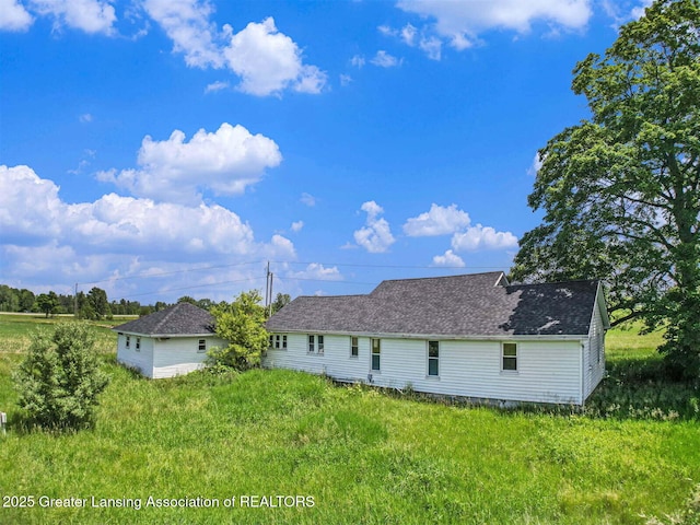 4548 Matthews Rd, Charlotte, MI 48813 - back of house with roof with shingles