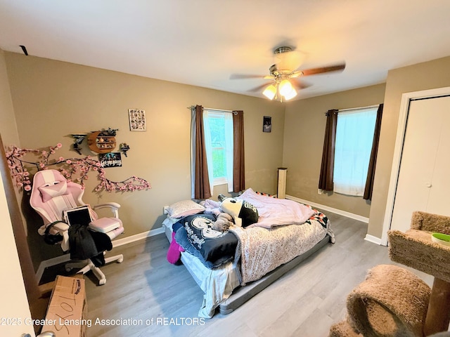 874 Brookdale St, Mason, MI 48854 - bedroom with wood finished floors and ceiling fan