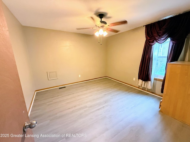 874 Brookdale St, Mason, MI 48854 - unfurnished room featuring ceiling fan and wood finished floors