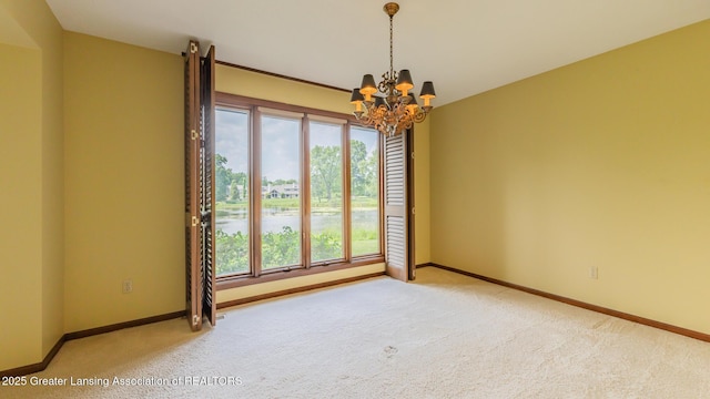 280 Winterberry Ln, Okemos, MI 48864 - carpeted spare room featuring a chandelier and plenty of natural light