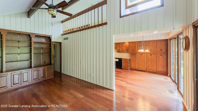 280 Winterberry Ln, Okemos, MI 48864 - unfurnished living room featuring high vaulted ceiling, light wood-type flooring, a ceiling fan, wooden walls, and beamed ceiling
