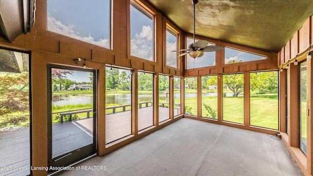 280 Winterberry Ln, Okemos, MI 48864 - unfurnished sunroom featuring a water view, hardwood / wood-style flooring, and lofted ceiling