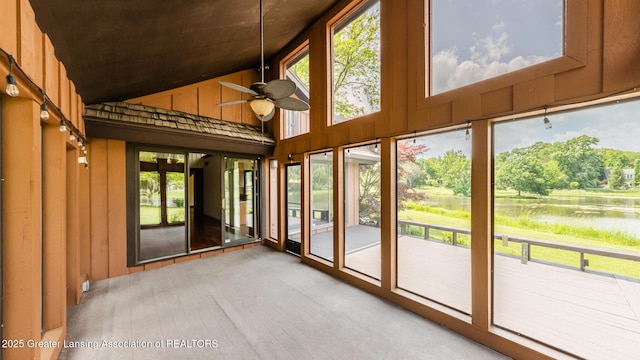 280 Winterberry Ln, Okemos, MI 48864 - unfurnished sunroom featuring high vaulted ceiling, a water view, and wooden walls